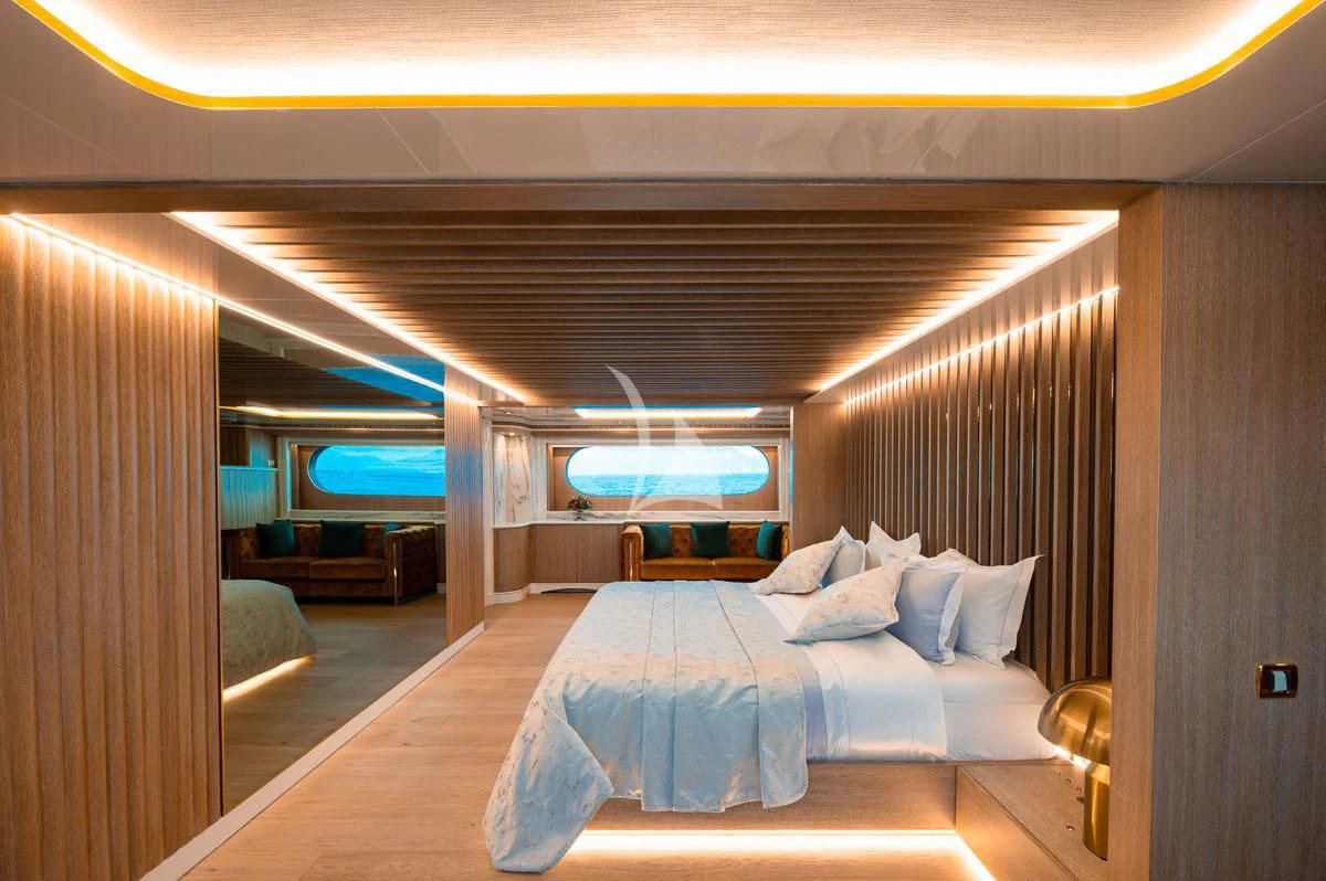 a room with a bed and a window aboard BARENTS Yacht for Charter