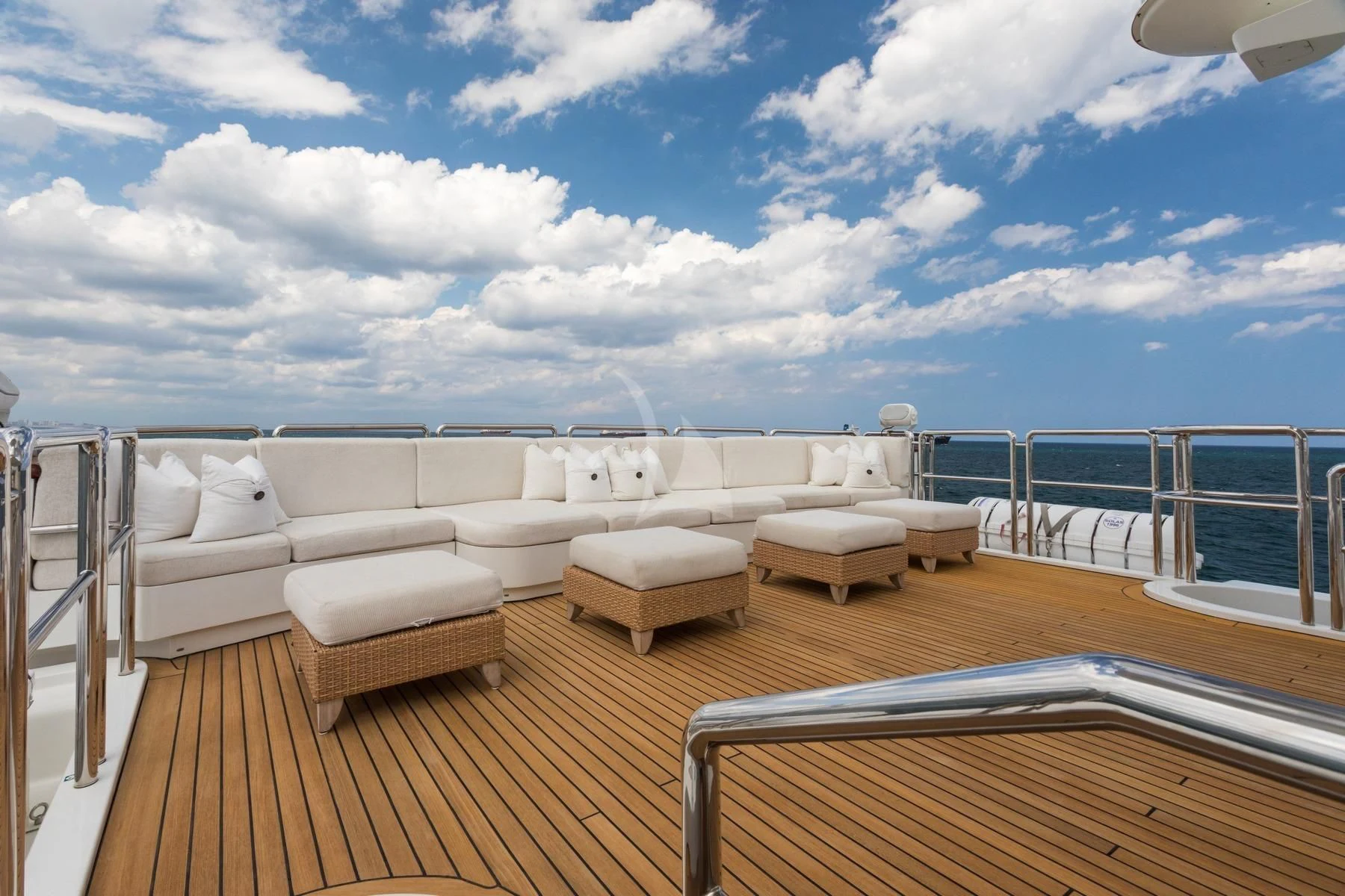 a deck with a view of the ocean and the ocean aboard BARENTS Yacht for Charter