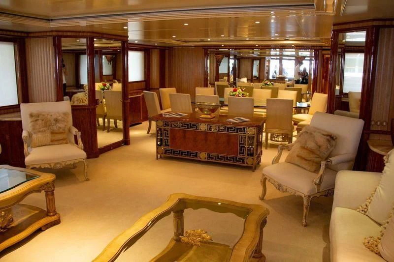 a living room with a table and chairs aboard BARENTS Yacht for Charter