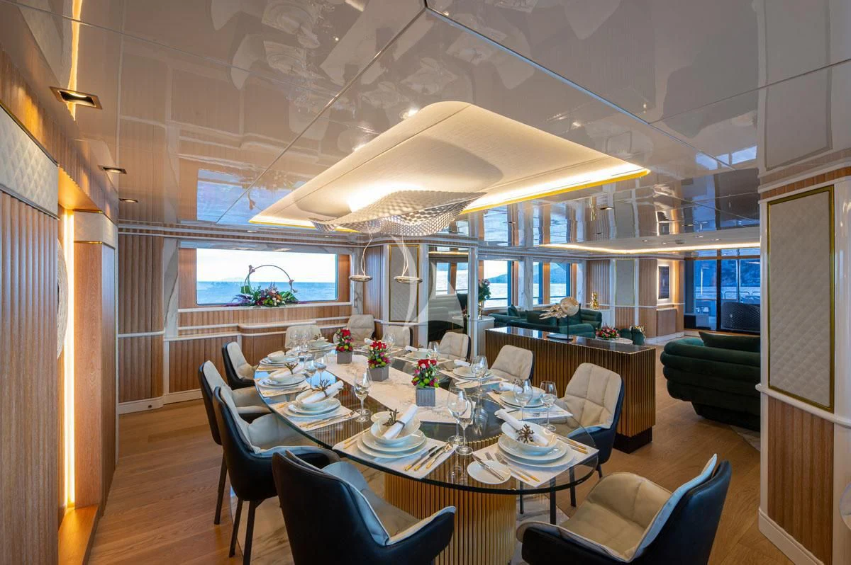 a dining room with a large table and chairs aboard BARENTS Yacht for Charter