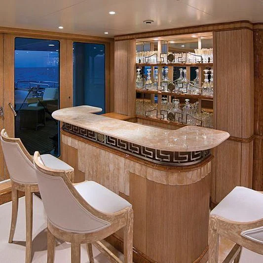 a room with a table and chairs aboard BARENTS Yacht for Charter