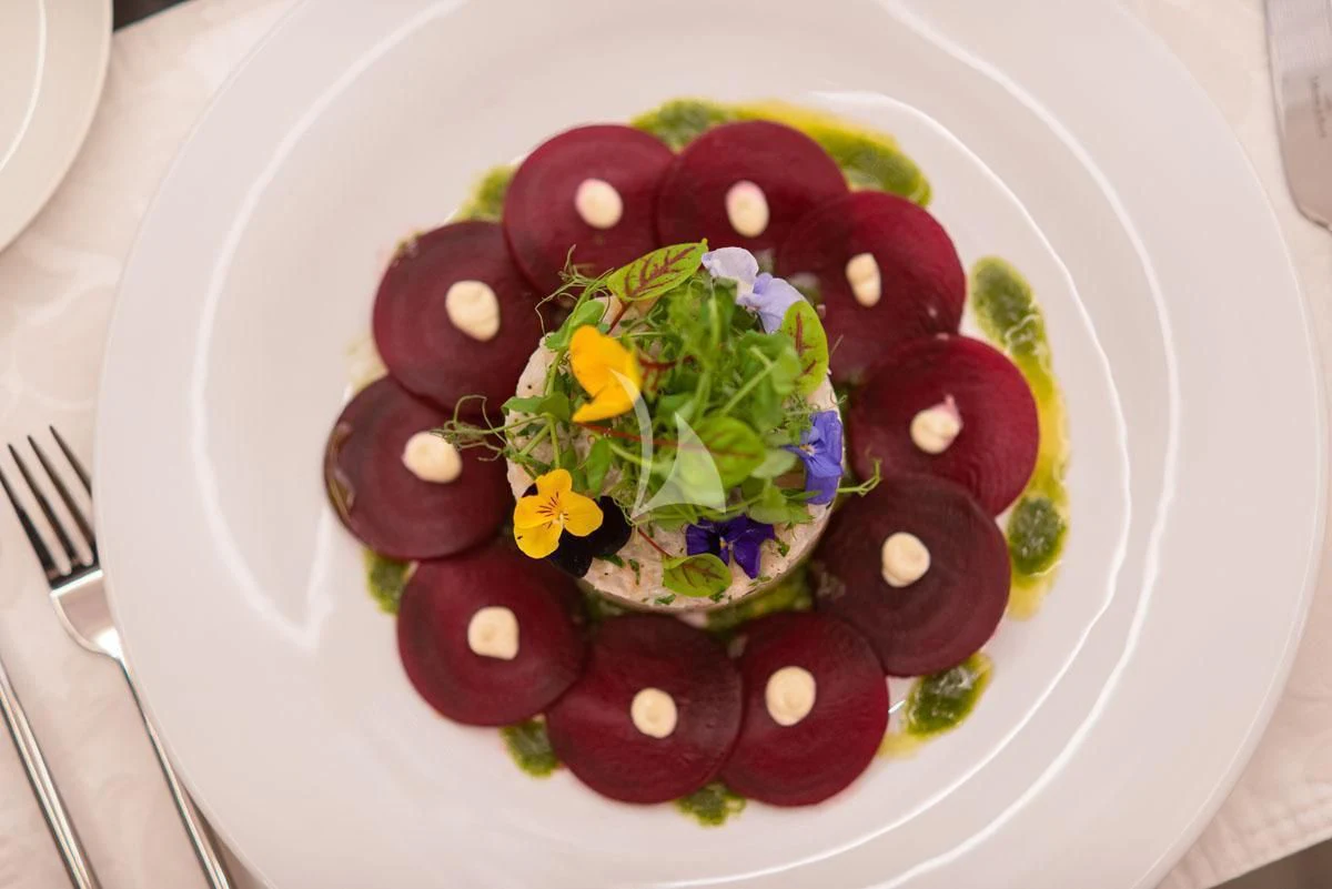 a plate of food aboard BARENTS Yacht for Charter