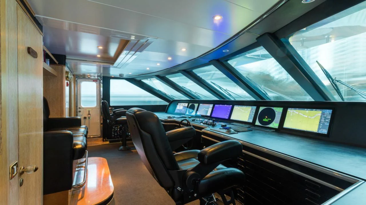 inside of a vehicle with a screen and a chair aboard BARENTS Yacht for Charter