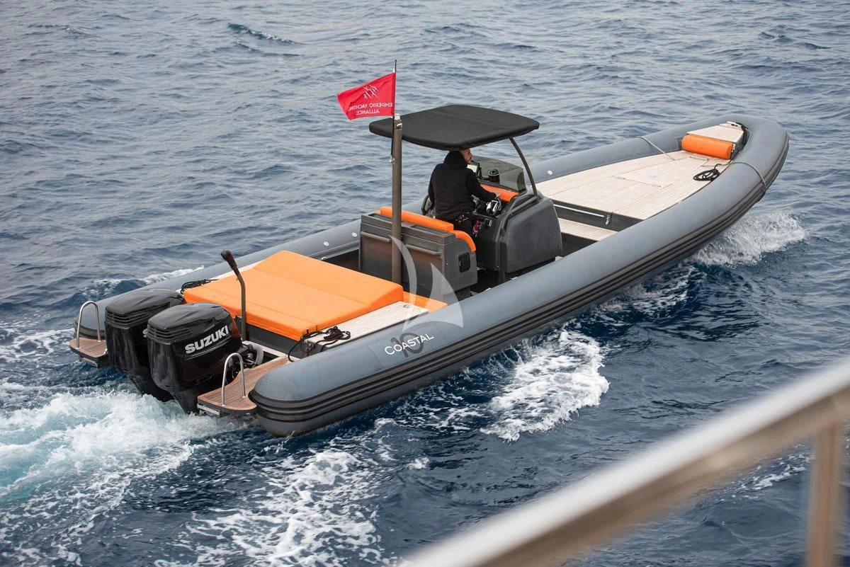 a person driving a speed boat aboard BARENTS Yacht for Charter