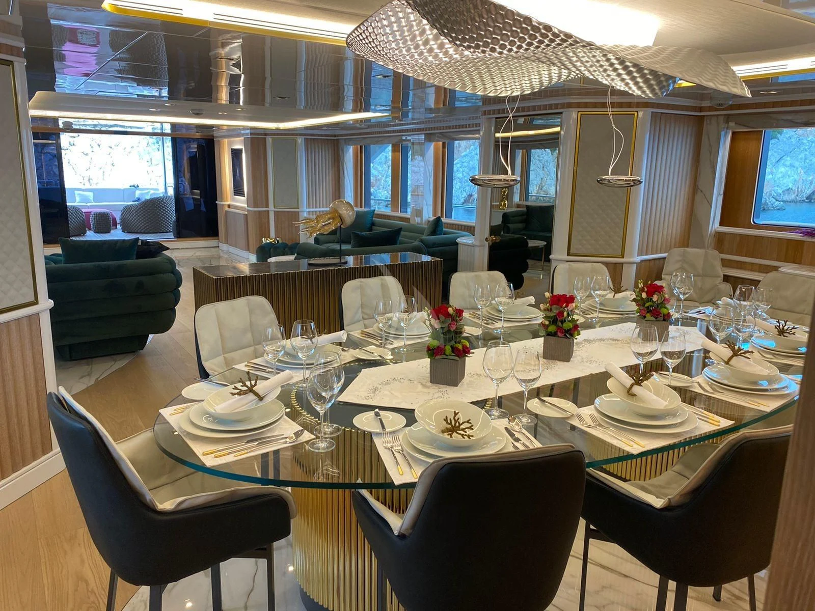 a room with tables and chairs aboard BARENTS Yacht for Charter