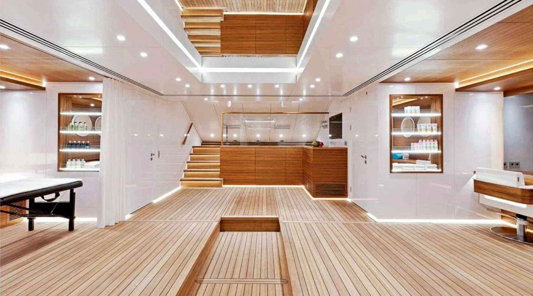 a room with wooden floors and a wood staircase aboard BARENTS Yacht for Charter