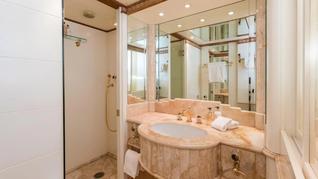 a bathroom with a large mirror aboard BARENTS Yacht for Charter