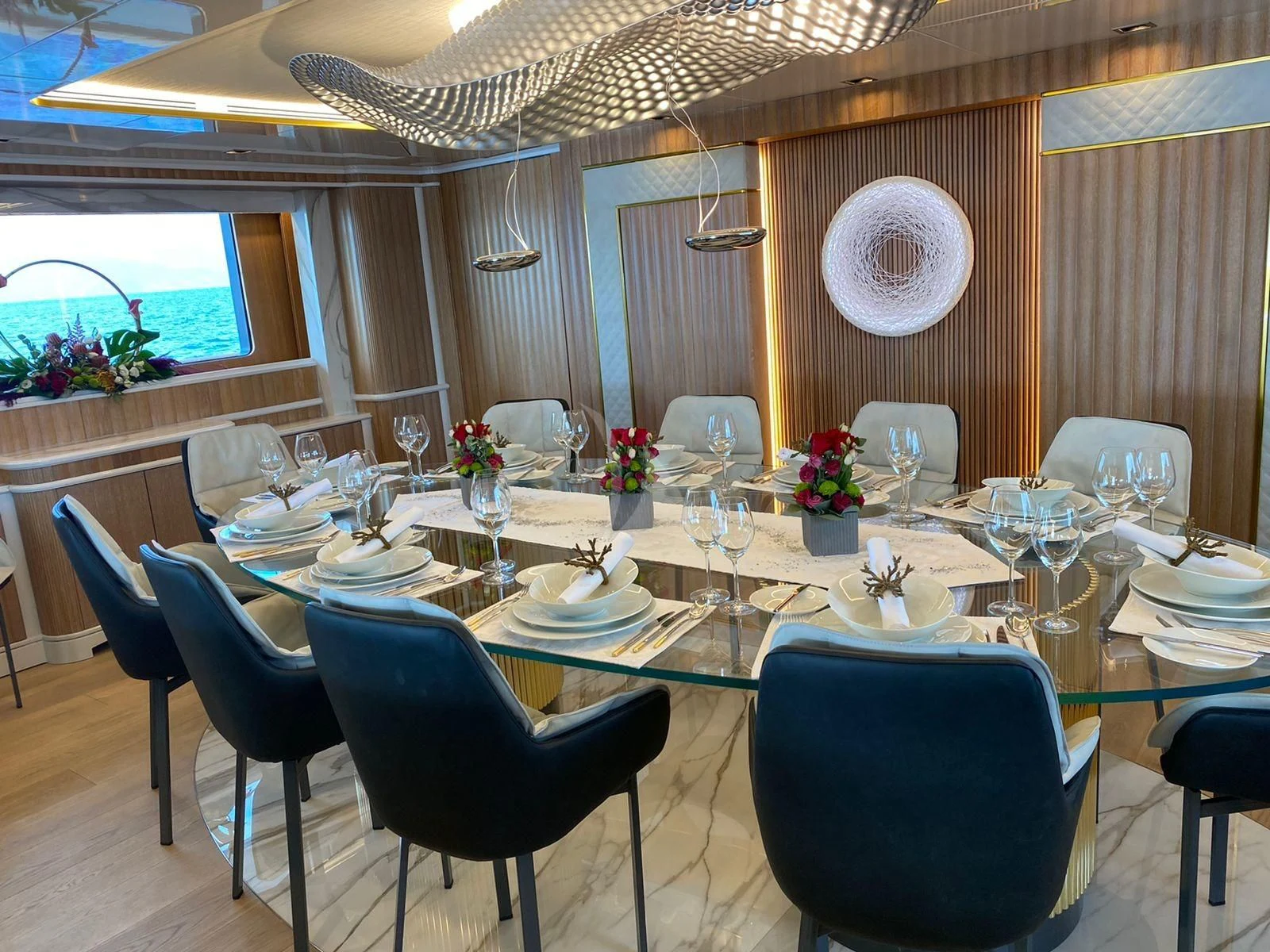 a large table set for a dinner aboard BARENTS Yacht for Charter