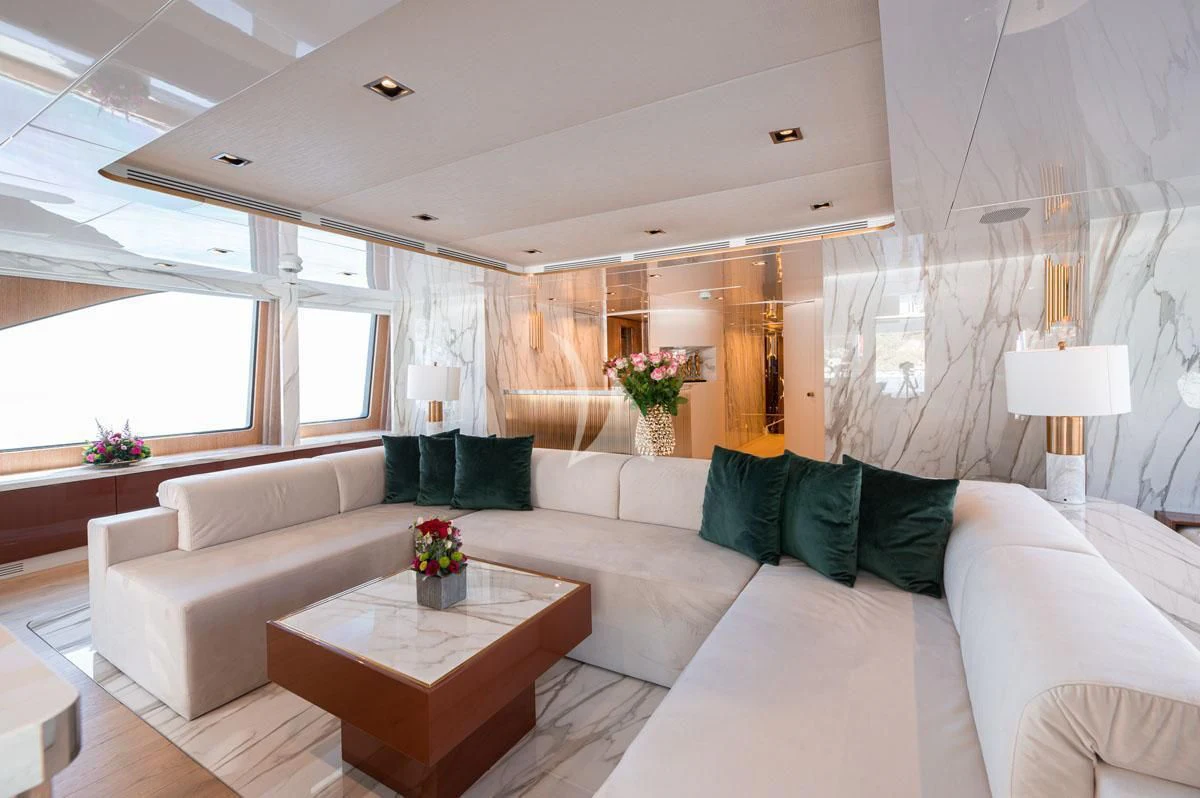 a living room with a couch and a table aboard BARENTS Yacht for Charter