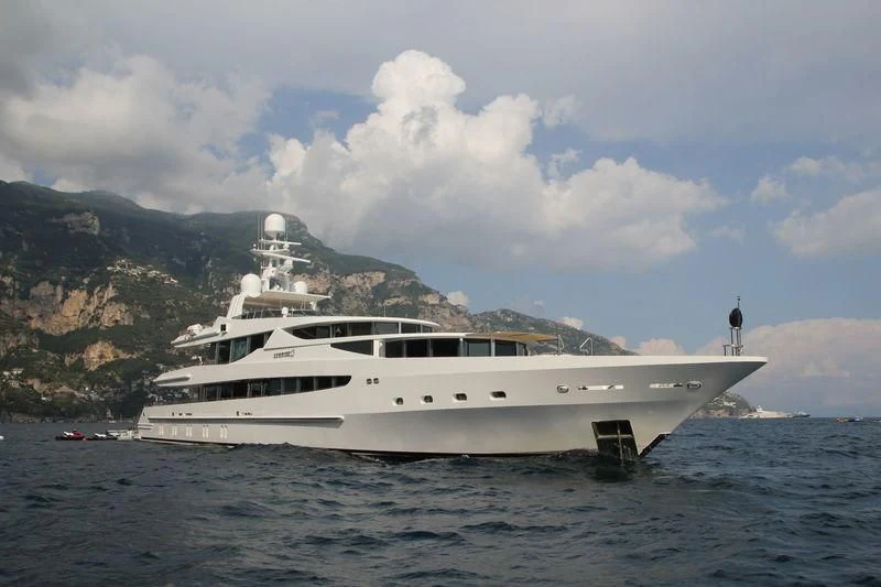 a large white boat in the water aboard FRIENDSHIP Yacht for Charter