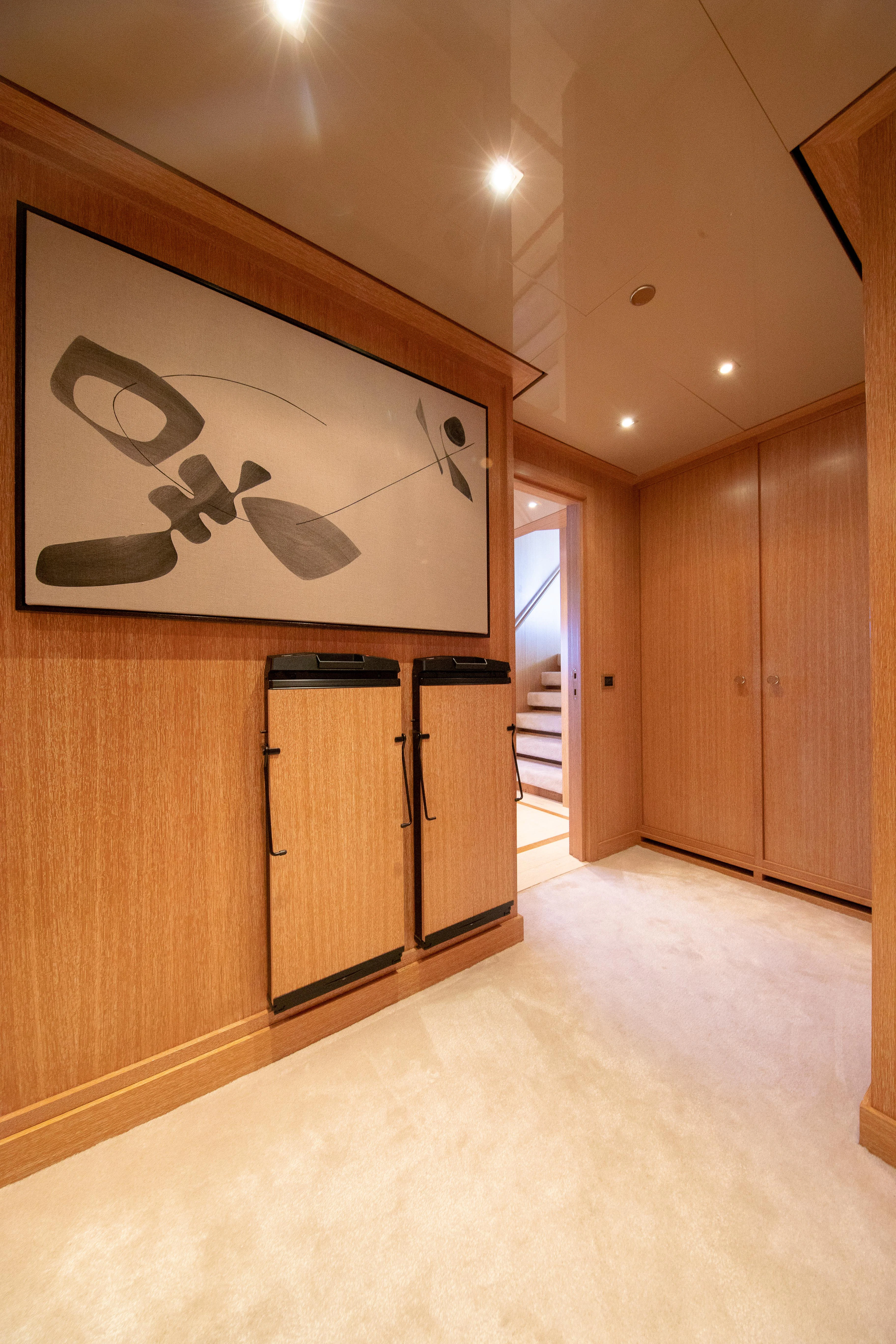 a room with wooden cabinets aboard FRIENDSHIP Yacht for Charter