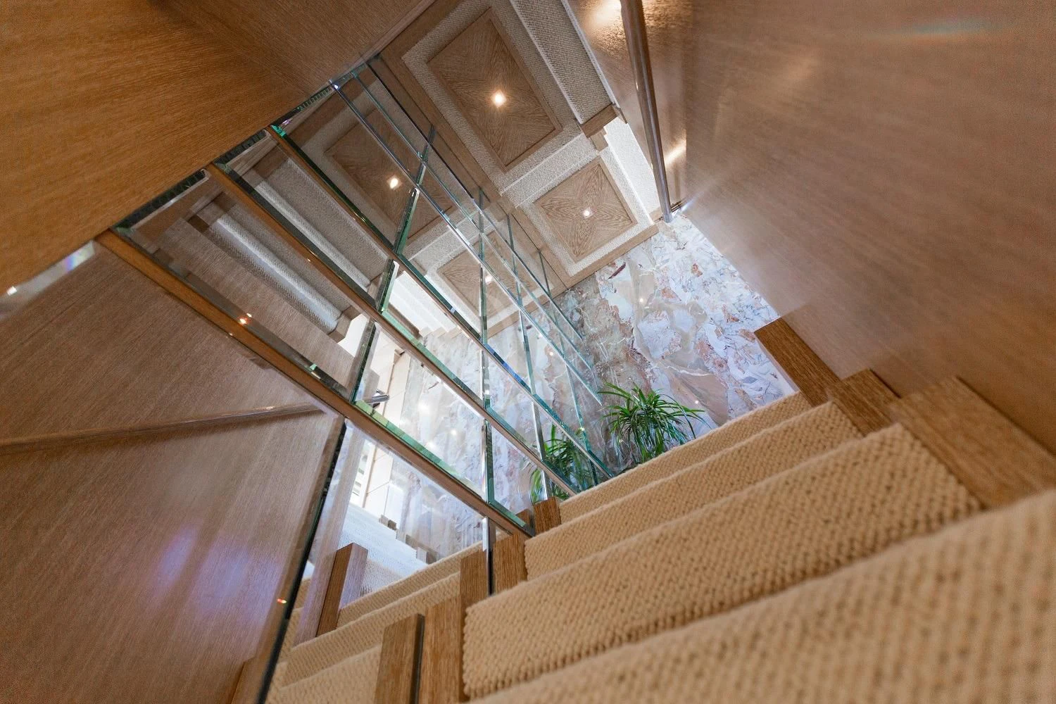 a staircase with a glass window aboard FRIENDSHIP Yacht for Charter