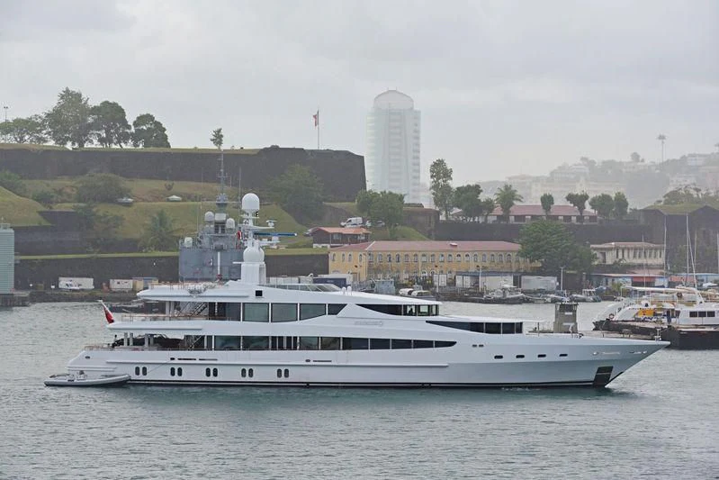 a large white boat in the water aboard FRIENDSHIP Yacht for Charter