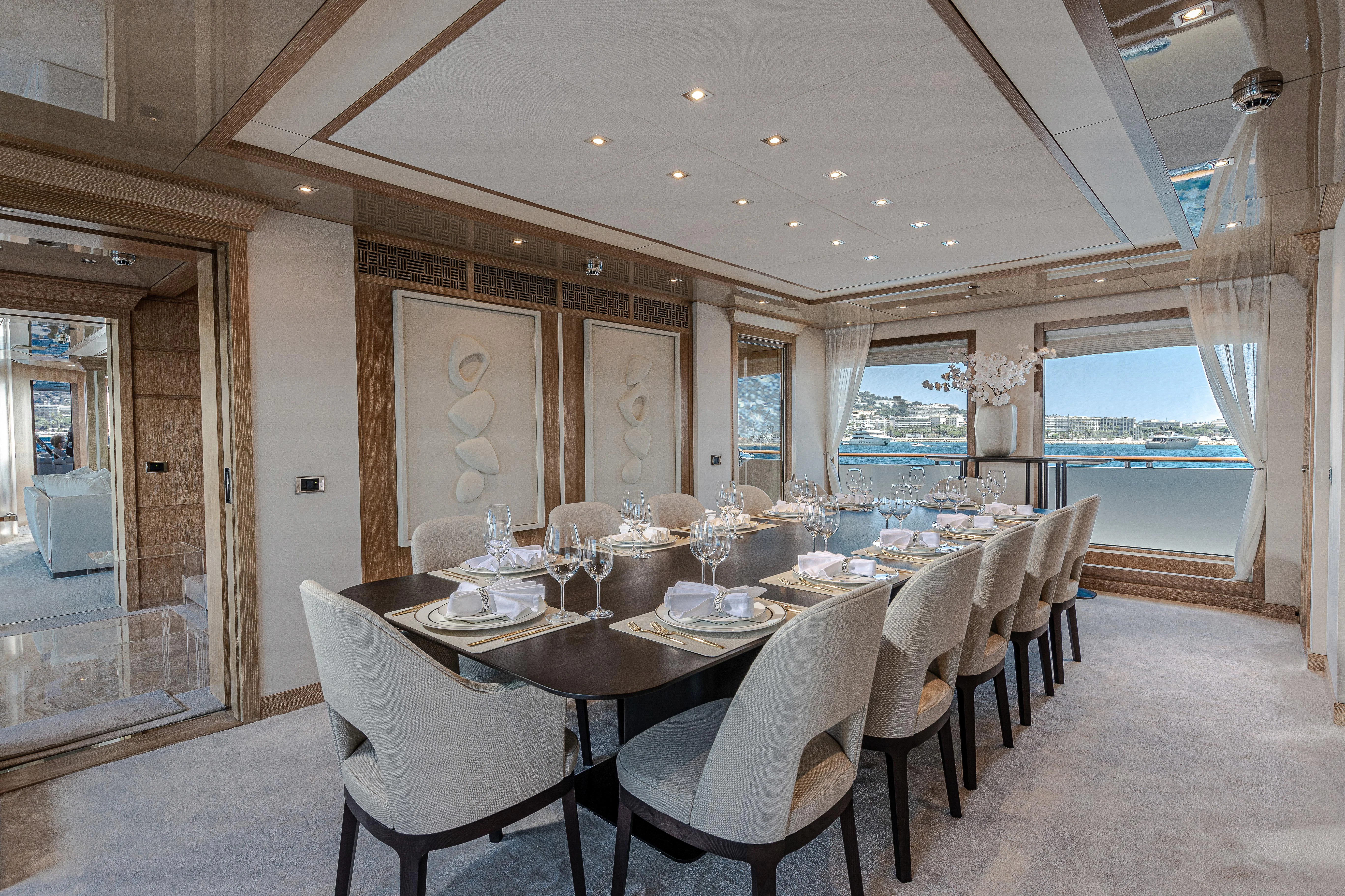 a dining room with a table set aboard FRIENDSHIP Yacht for Charter