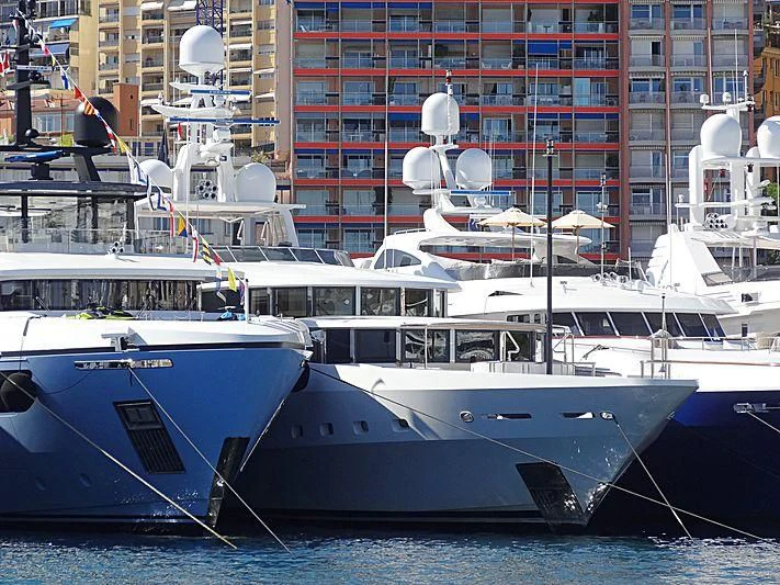 several boats in a harbor aboard FRIENDSHIP Yacht for Charter