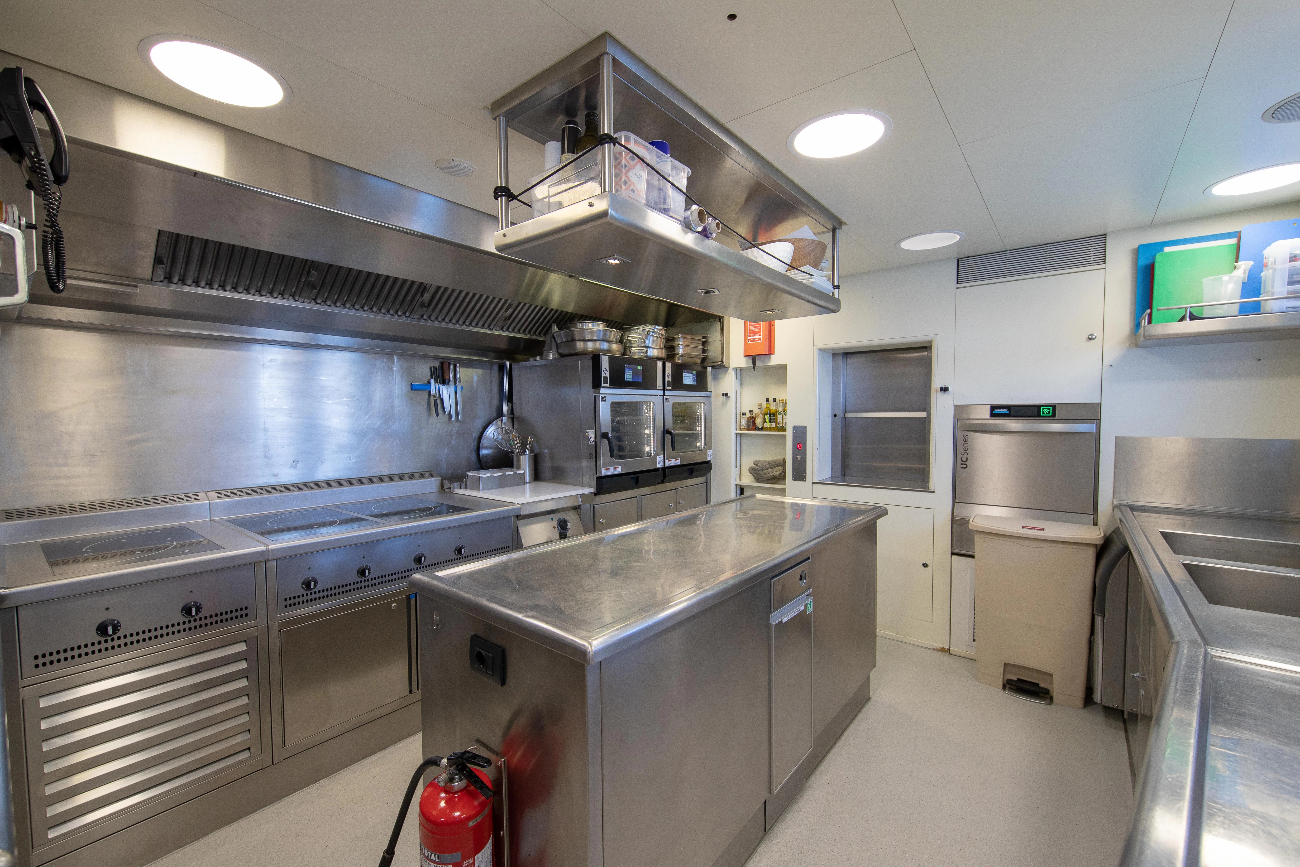a kitchen with stainless steel appliances aboard FRIENDSHIP Yacht for Charter