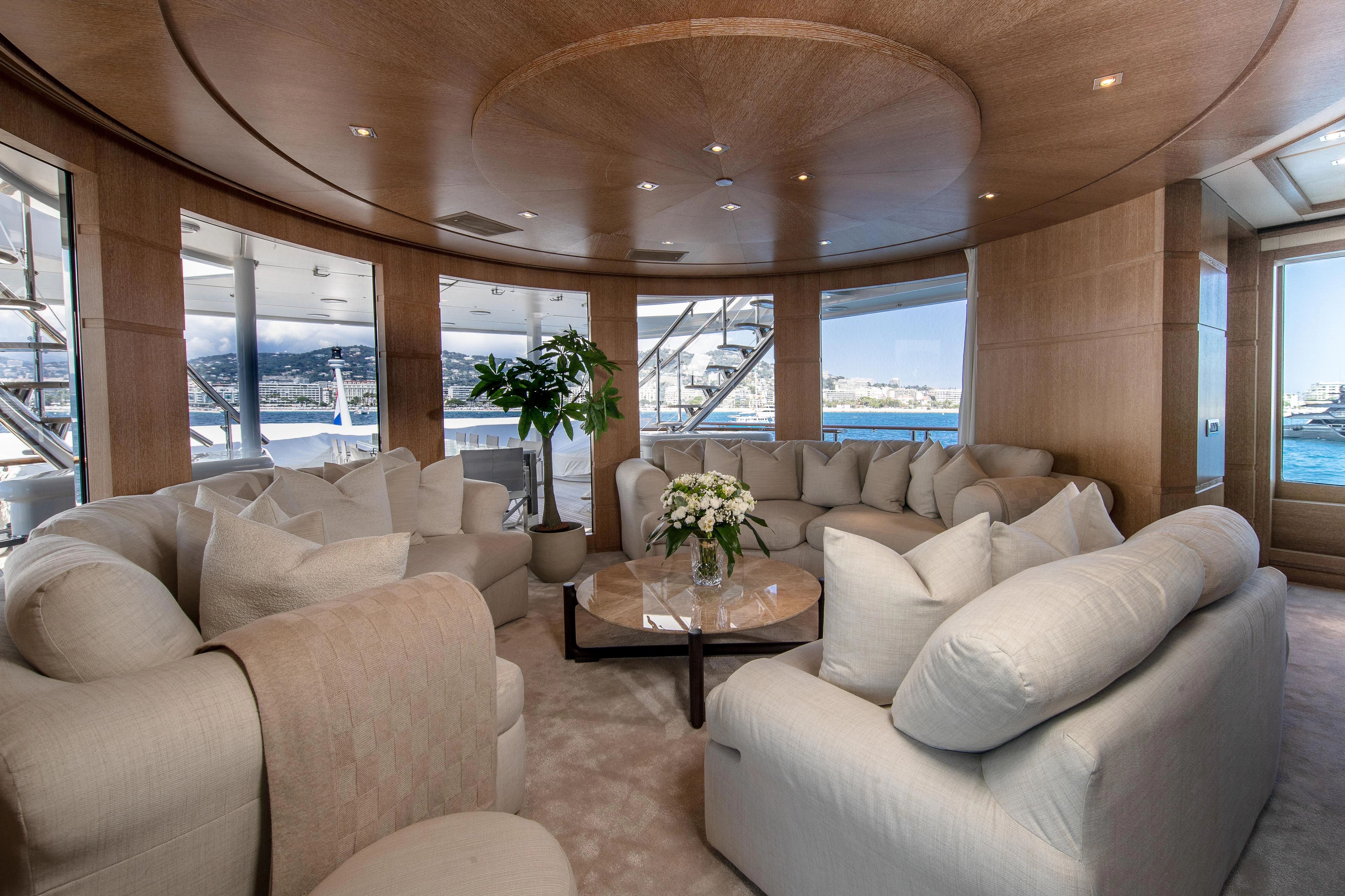 a living room with a large window aboard FRIENDSHIP Yacht for Charter