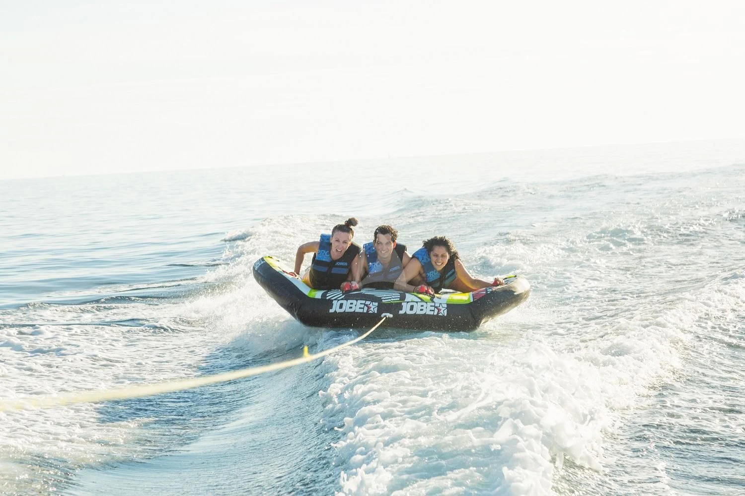 a group of people on a raft in the water aboard FRIENDSHIP Yacht for Charter