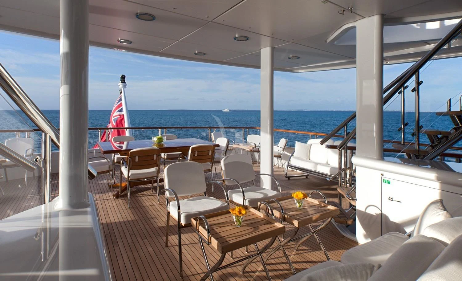 a room with a table and chairs aboard FRIENDSHIP Yacht for Charter