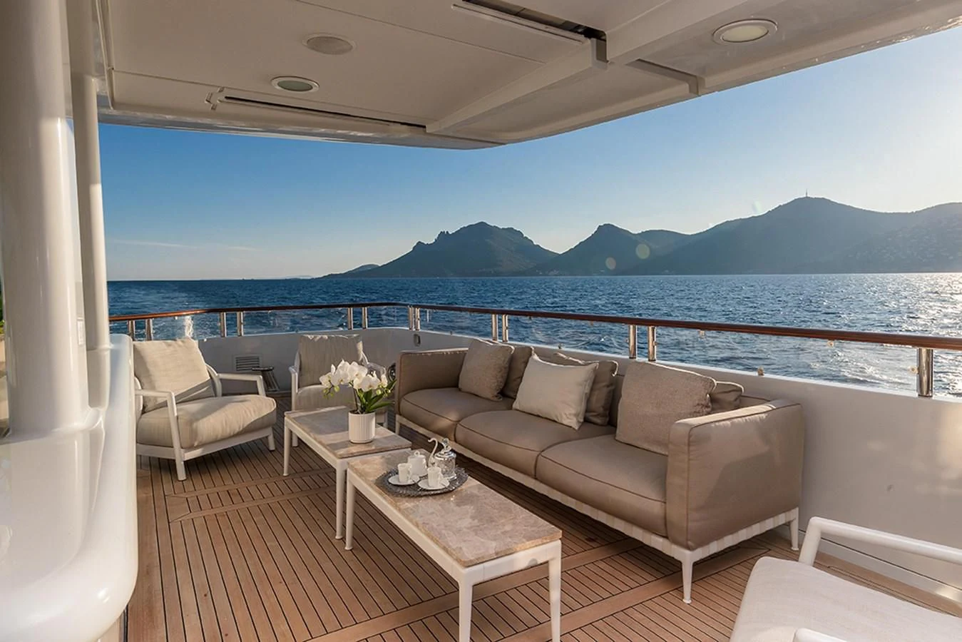a couch and a table on a boat aboard FRIENDSHIP Yacht for Charter