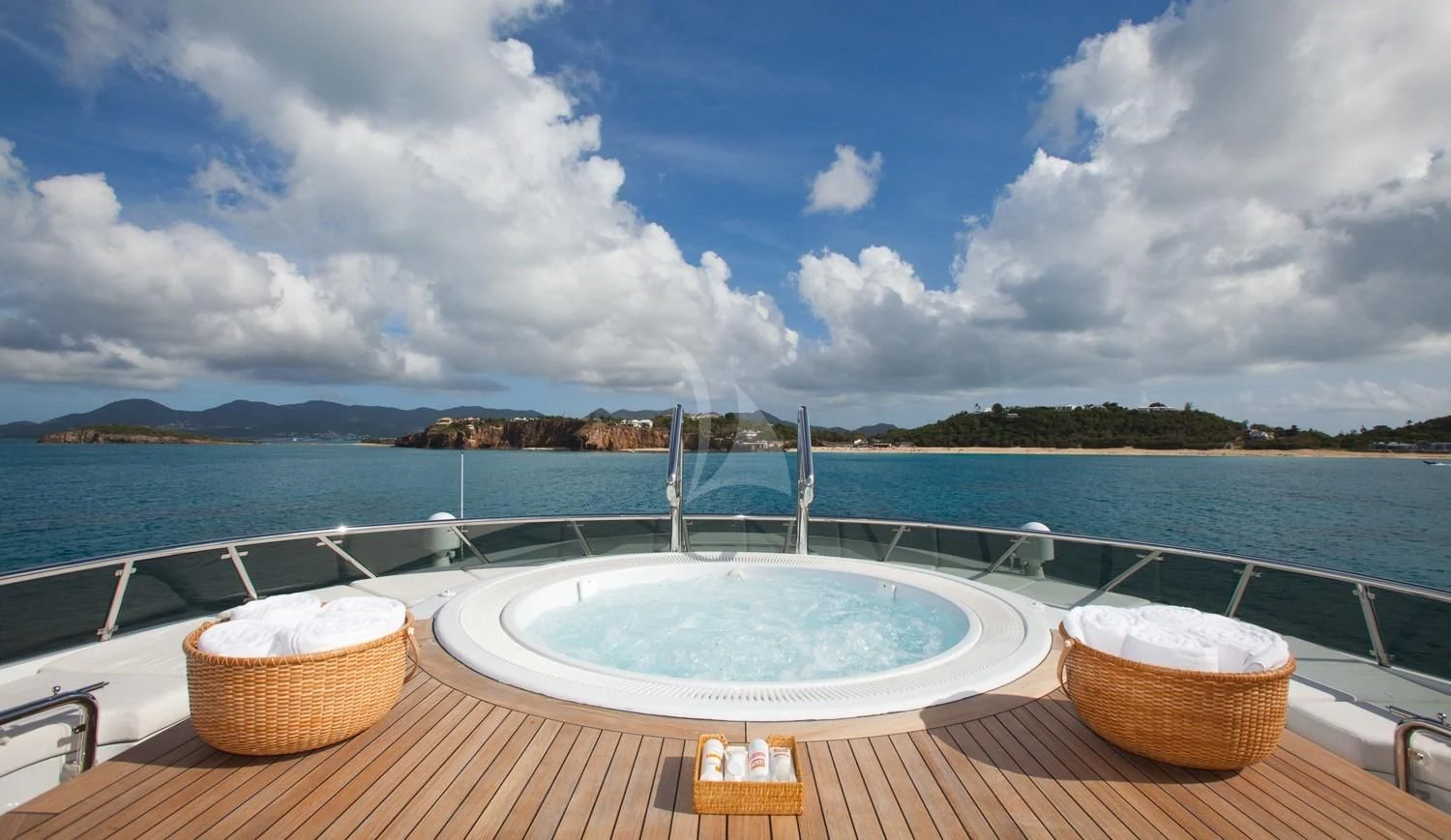 a couple of baskets on a deck overlooking a body of water aboard FRIENDSHIP Yacht for Charter
