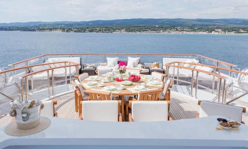 a table set for a meal on a boat aboard FRIENDSHIP Yacht for Charter