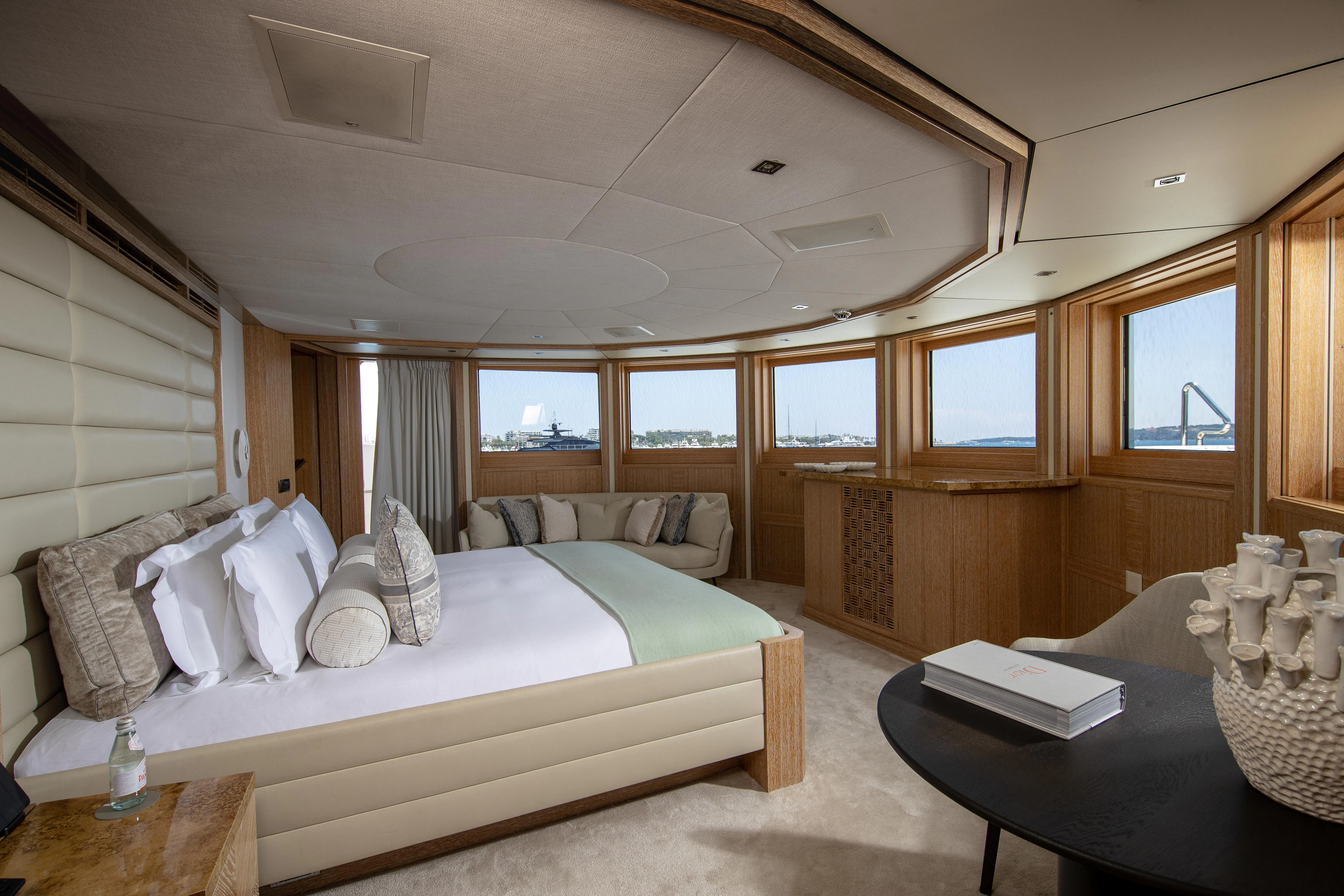 a room with a bed and a table aboard FRIENDSHIP Yacht for Charter