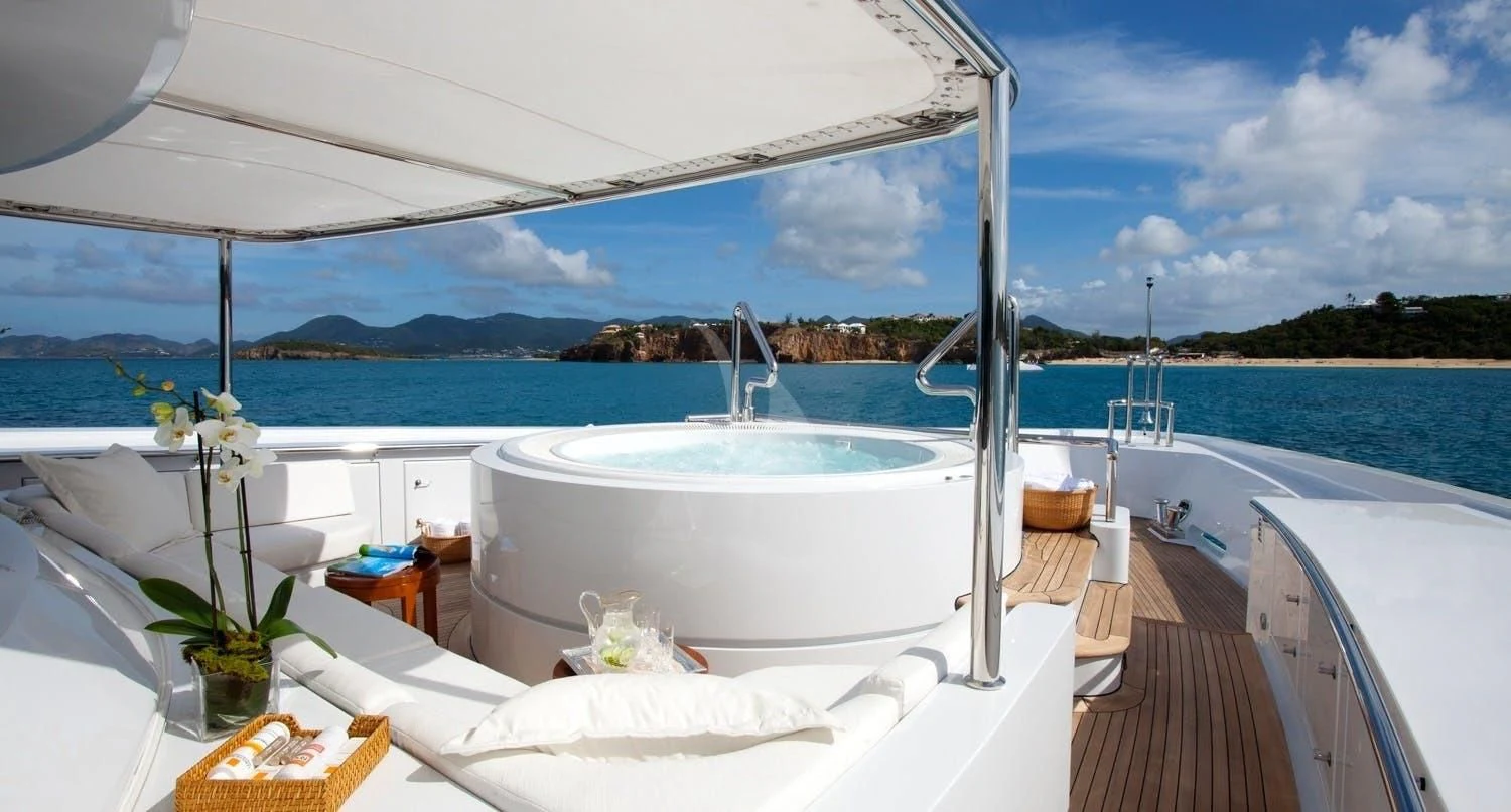 a white bed on a boat aboard FRIENDSHIP Yacht for Charter