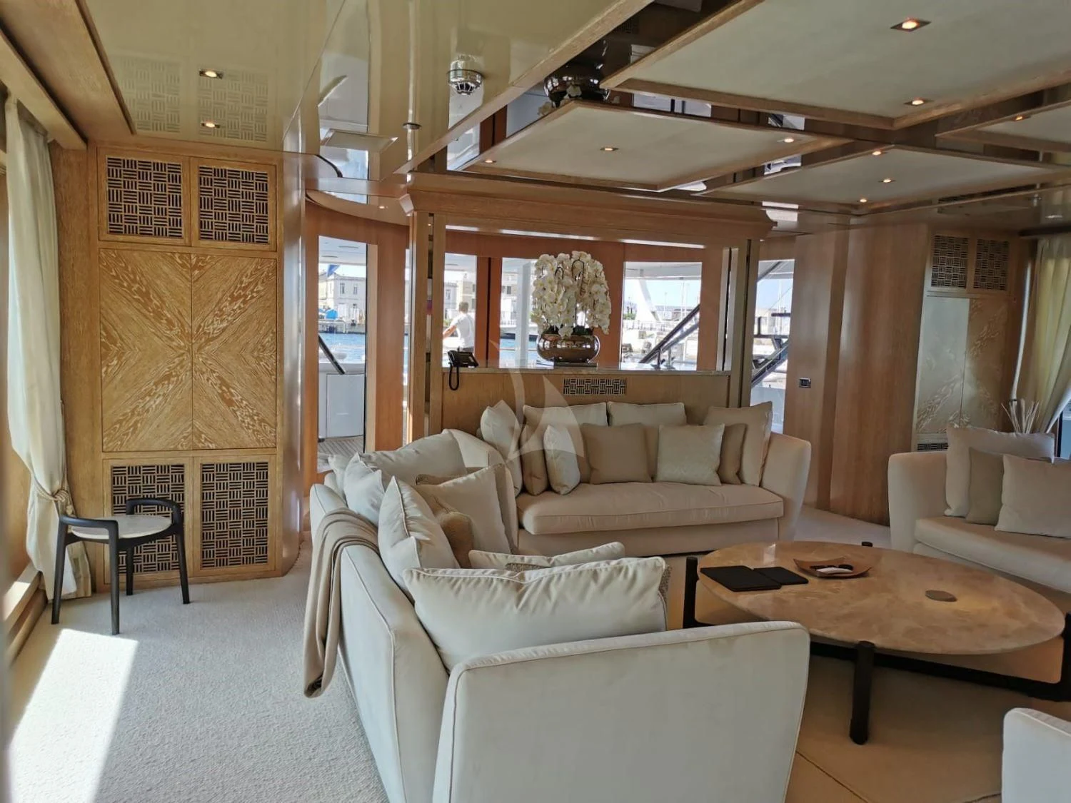a living room with a large window aboard FRIENDSHIP Yacht for Charter