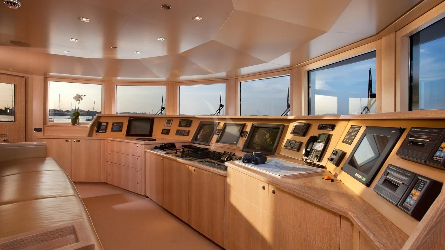 a kitchen with wooden cabinets aboard FRIENDSHIP Yacht for Charter