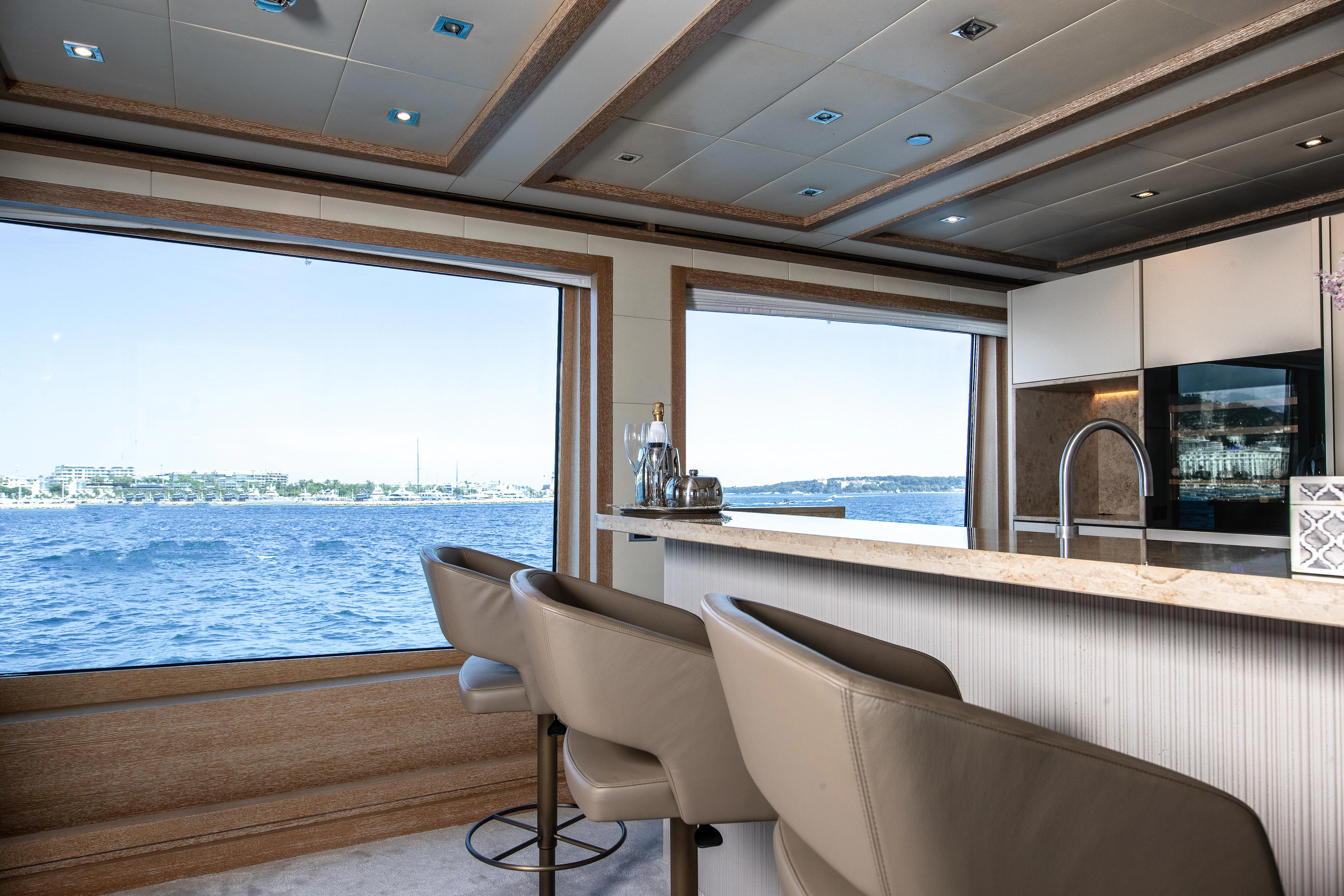 a room with a view of the water and the land aboard FRIENDSHIP Yacht for Charter