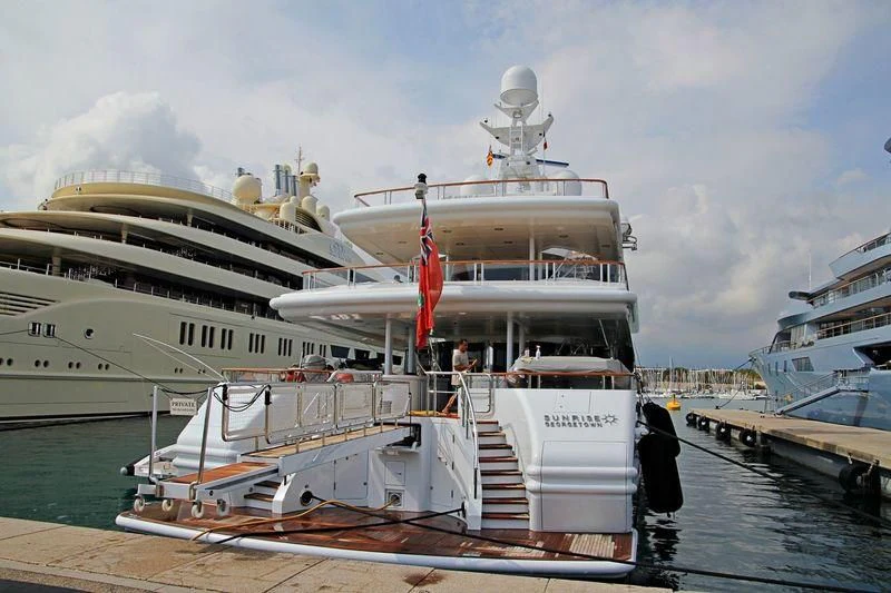 a large cruise ship docked aboard FRIENDSHIP Yacht for Charter