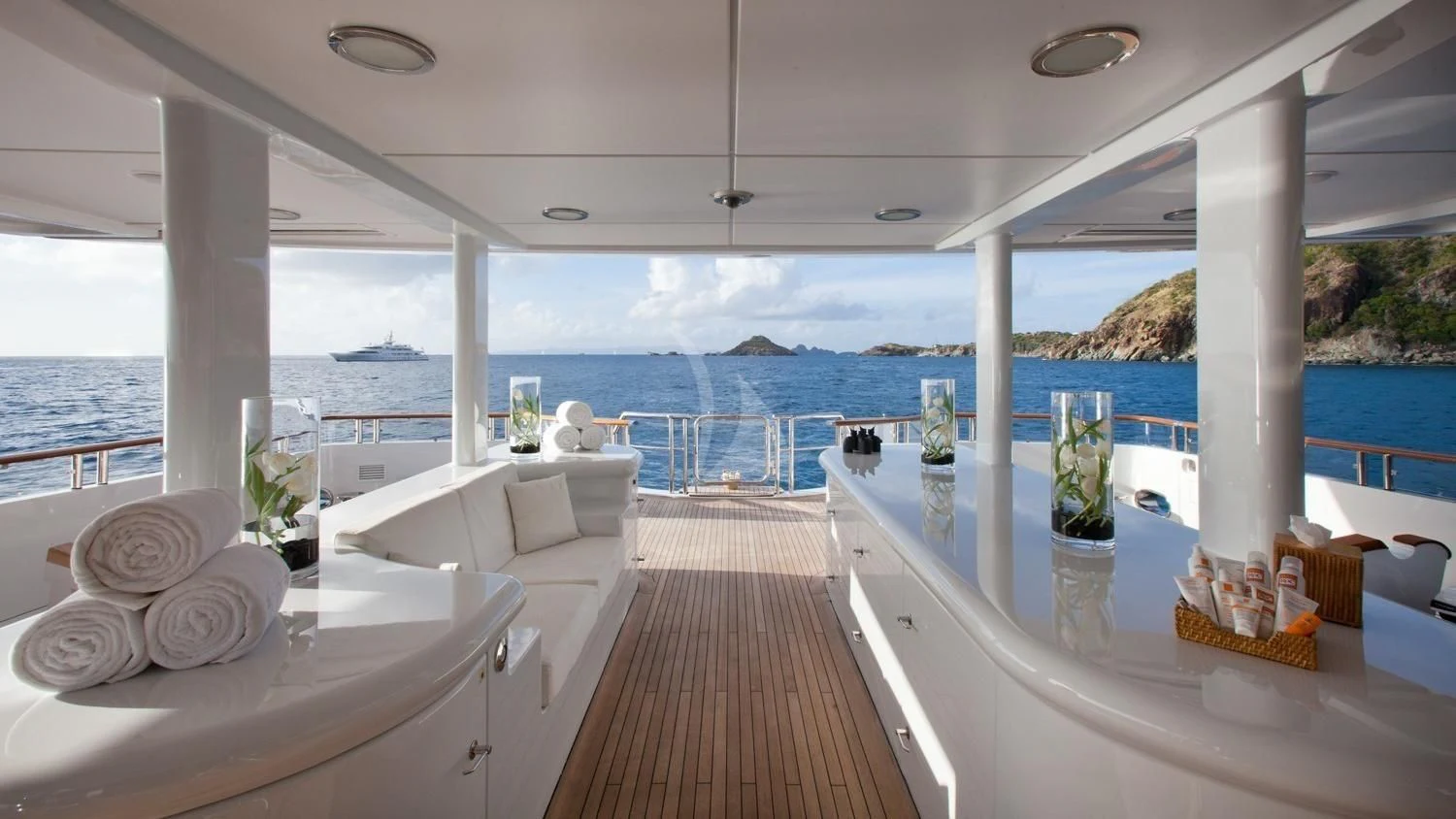 a large open area with a large window and a view of the ocean aboard FRIENDSHIP Yacht for Charter