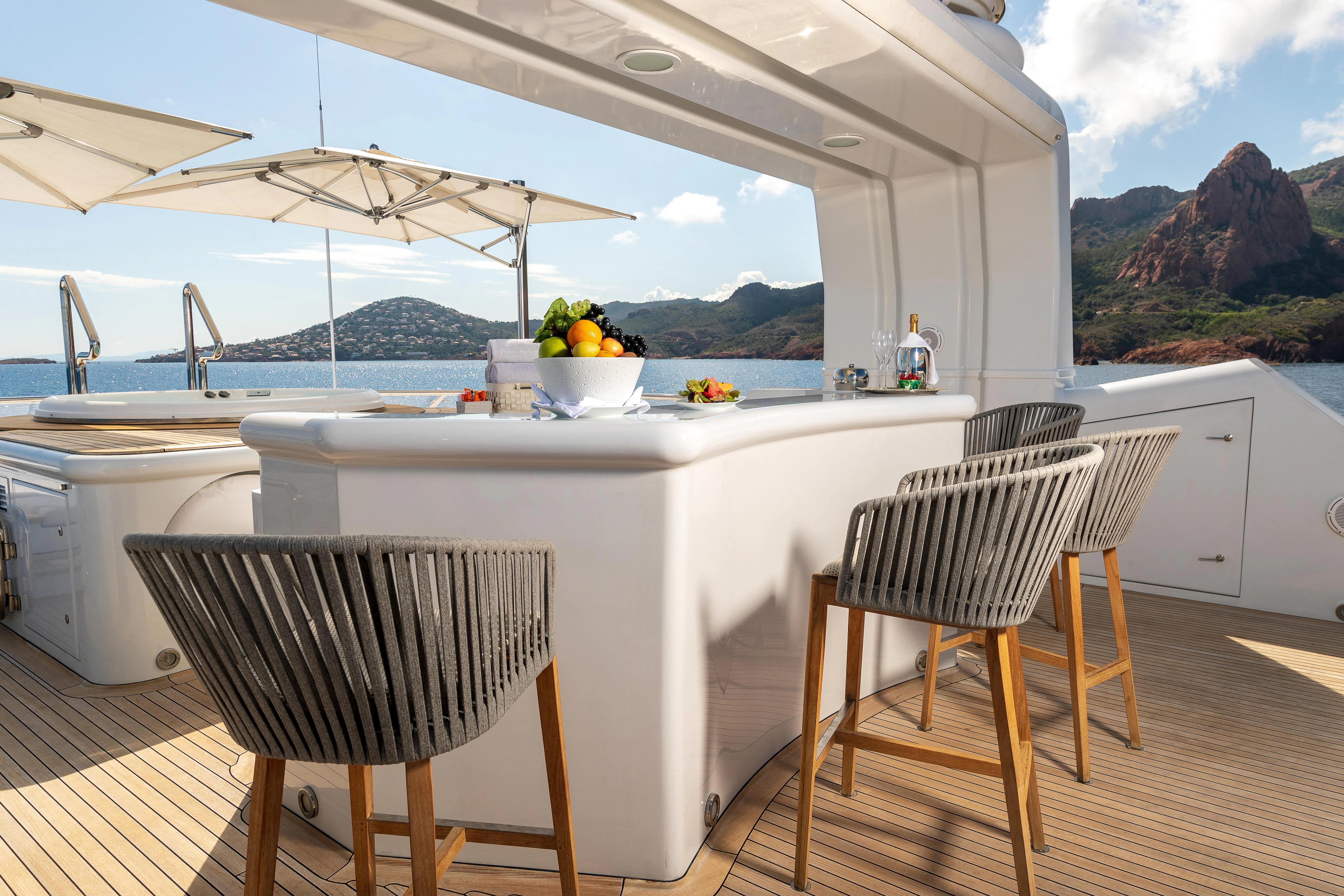 a table and chairs on a deck aboard FRIENDSHIP Yacht for Charter