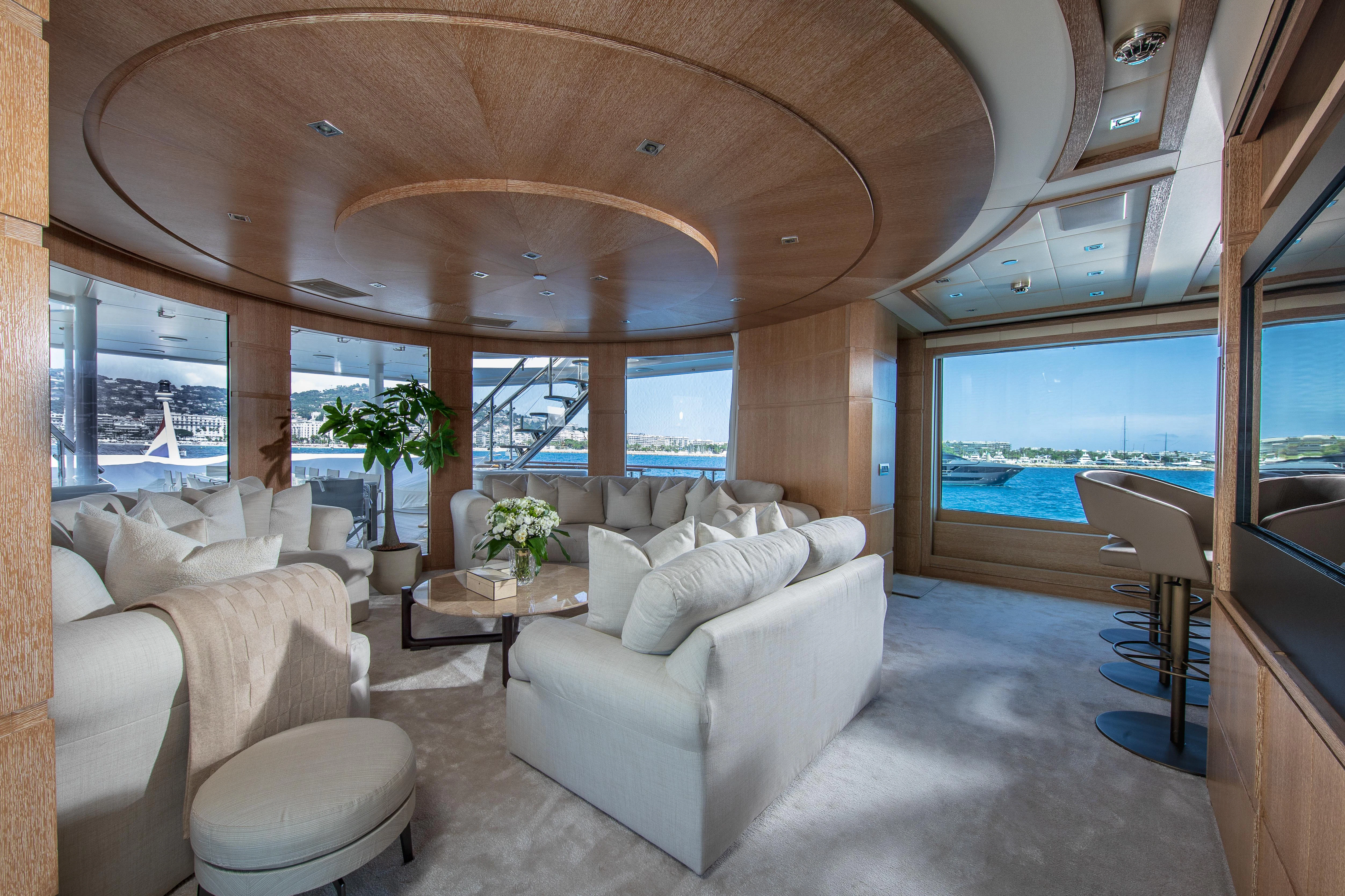 a living room with a large window aboard FRIENDSHIP Yacht for Charter