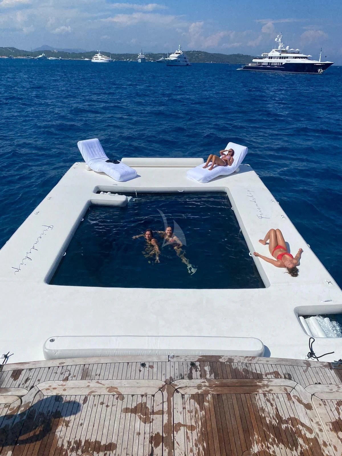a group of people on a boat aboard FRIENDSHIP Yacht for Charter