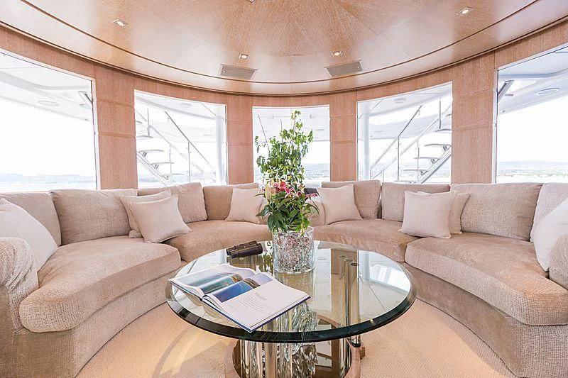 a living room with a couch and a coffee table aboard FRIENDSHIP Yacht for Charter