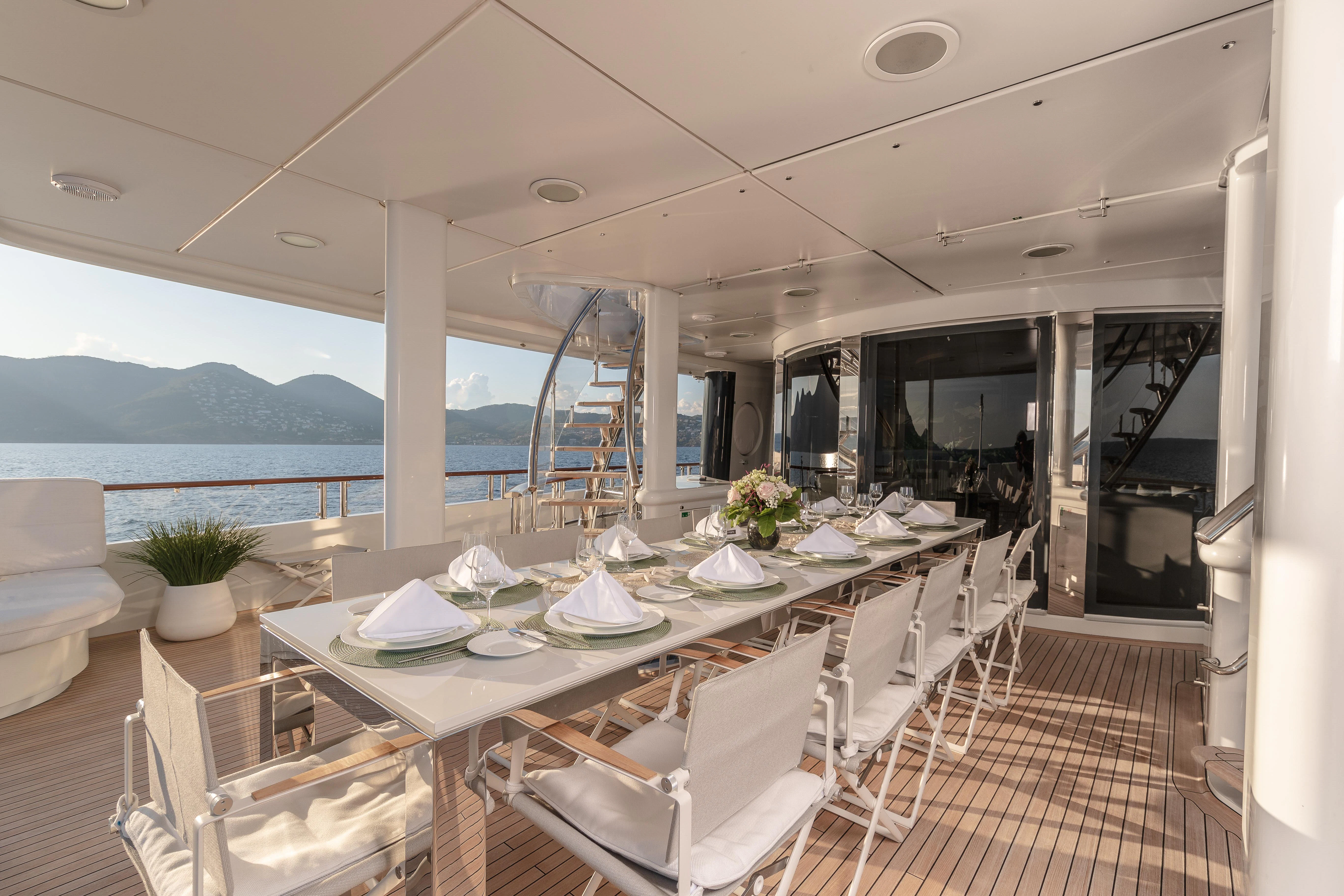 a dining room with a large table aboard FRIENDSHIP Yacht for Charter