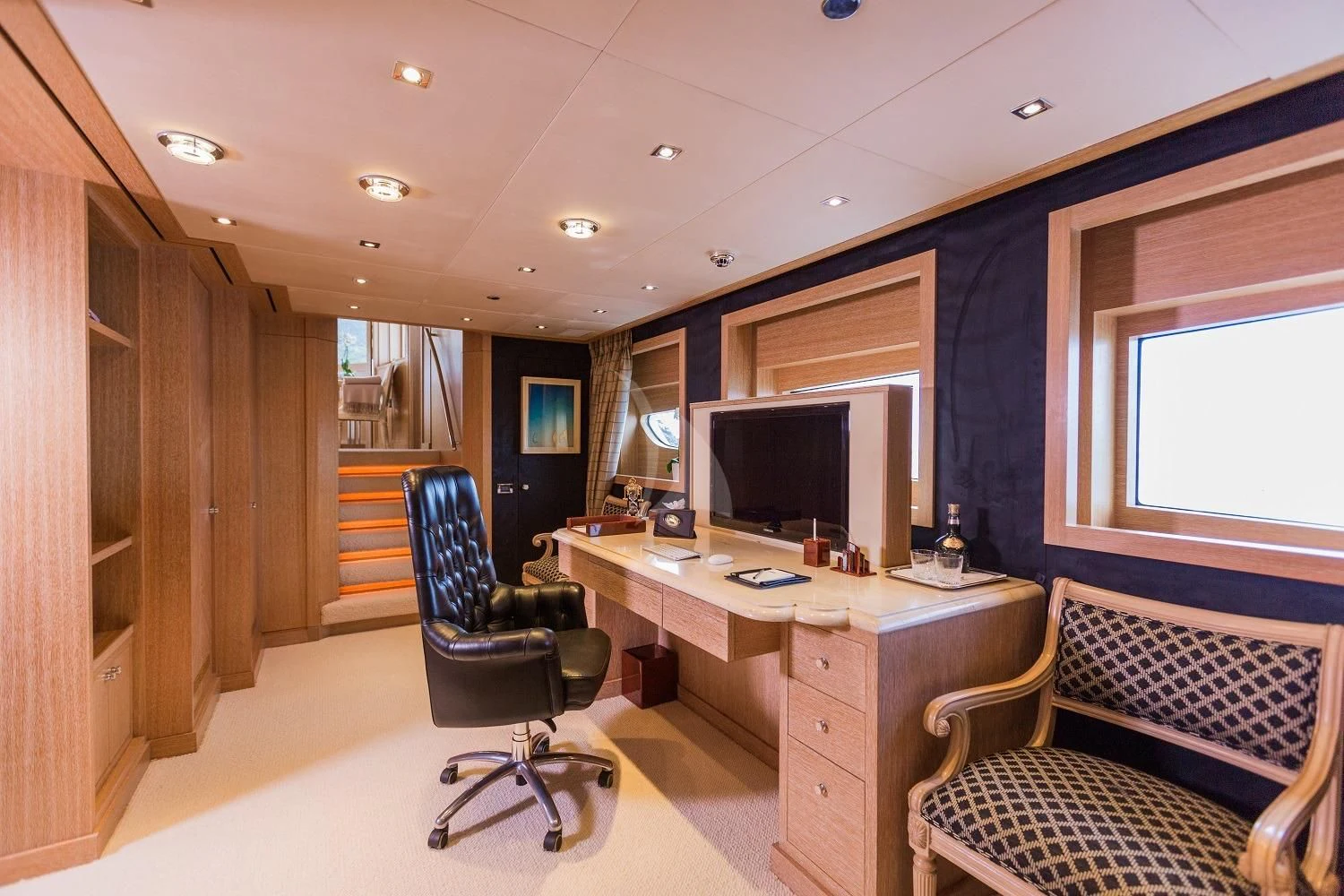 a room with a desk and a chair aboard FRIENDSHIP Yacht for Charter