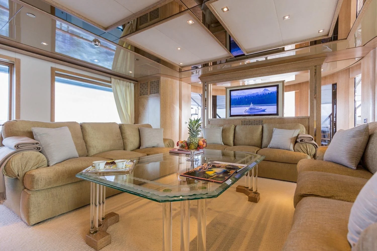 a living room with a large screen aboard FRIENDSHIP Yacht for Charter