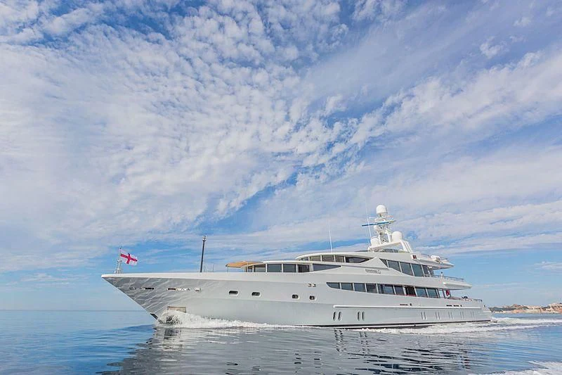 a large white boat in the water aboard FRIENDSHIP Yacht for Charter