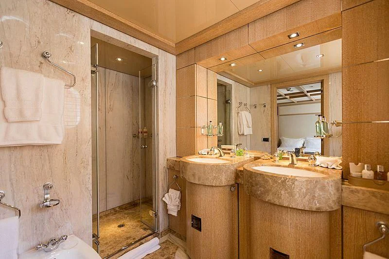 a bathroom with a sink and a mirror aboard FRIENDSHIP Yacht for Charter