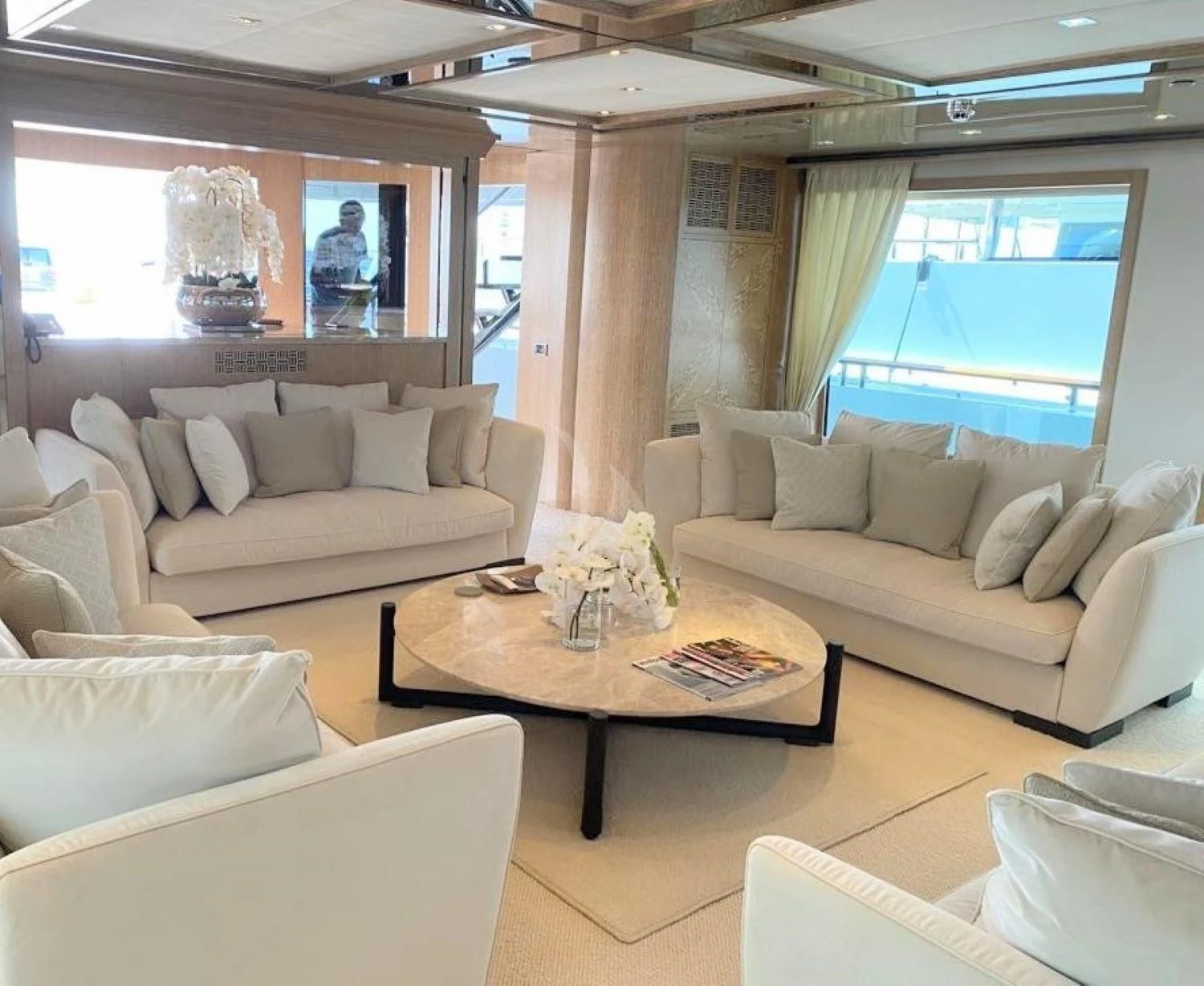 a living room with a couch and a coffee table aboard FRIENDSHIP Yacht for Charter