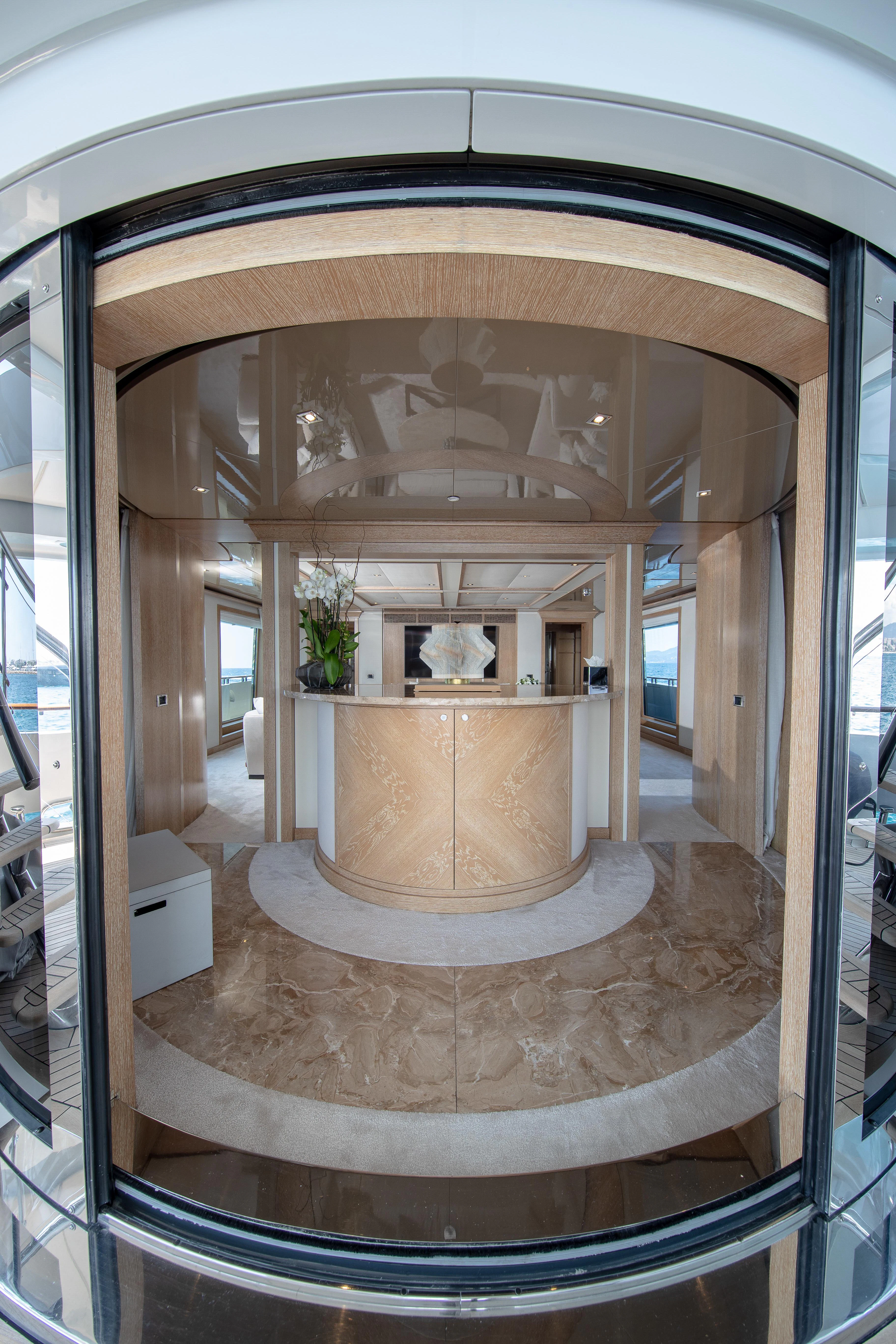 a large marble room with a large mirror aboard FRIENDSHIP Yacht for Charter
