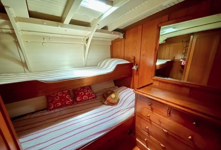 a room with bunk beds aboard SO FONG Yacht for Sale