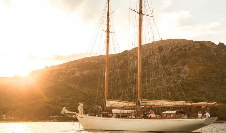 a boat with a sail on the water aboard SO FONG Yacht for Sale