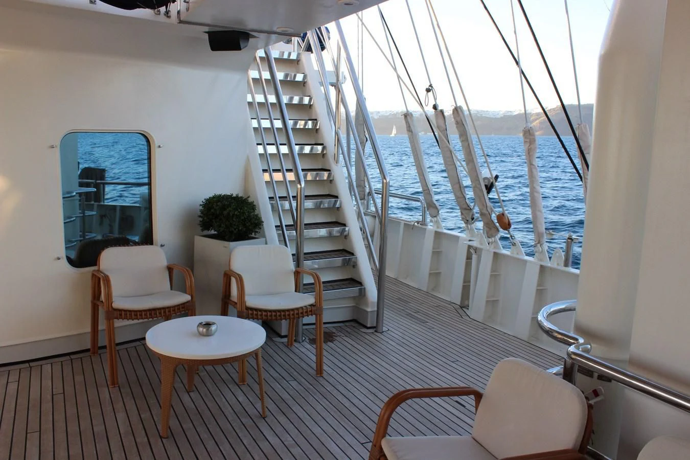 a balcony with a view of the ocean aboard RUNNING ON WAVES Yacht for Charter