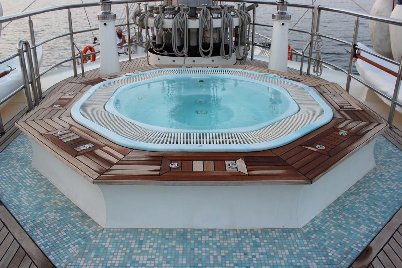 a pool with a deck aboard RUNNING ON WAVES Yacht for Charter
