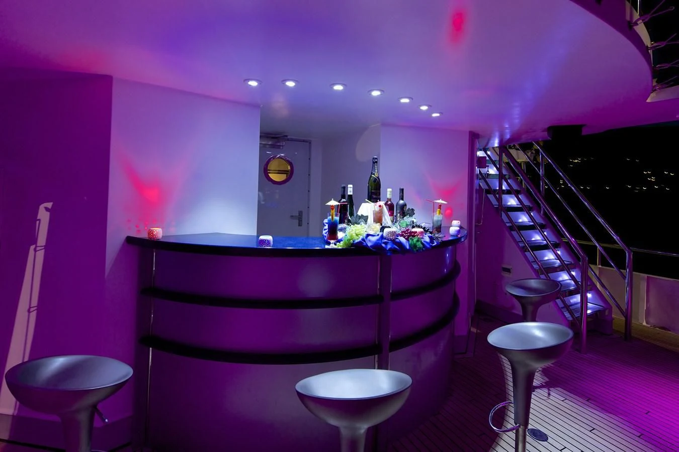 a bar with stools and stools aboard RUNNING ON WAVES Yacht for Charter