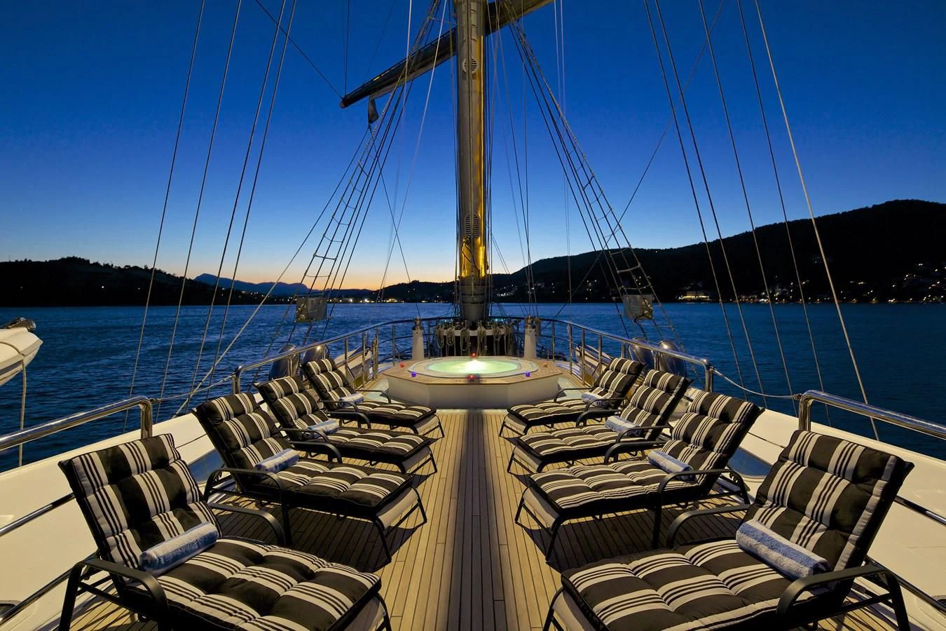 a boat with many seats on it aboard RUNNING ON WAVES Yacht for Charter